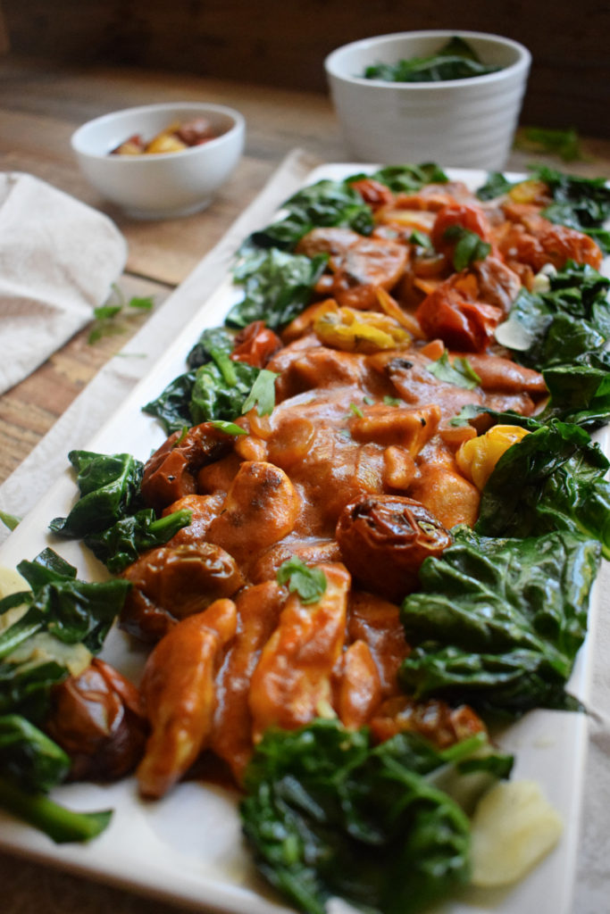 close uf ofthe hot paprika with sauteed spinach