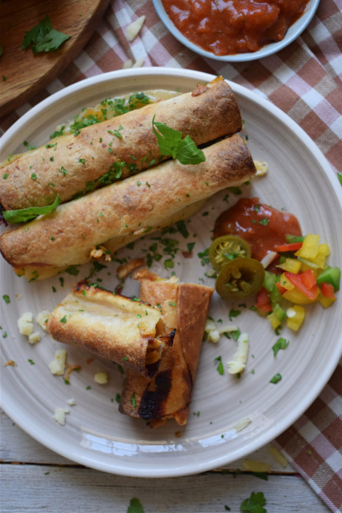 slow cooker chicken taquitos on a plate