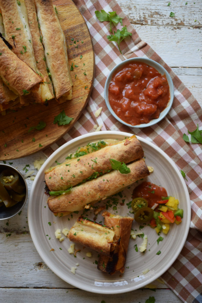 over head table setting view of the slow cooker chicken taquitos