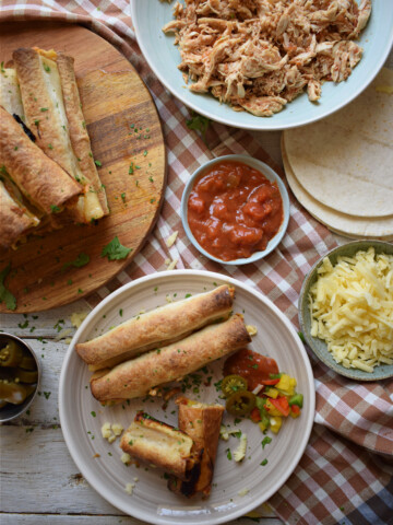 table setting view of the slow cooker chicken taquitos