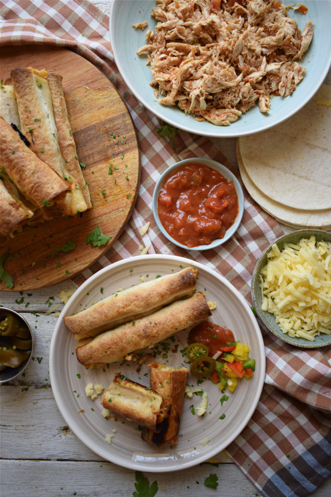 table setting view of the slow cooker chicken taquitos