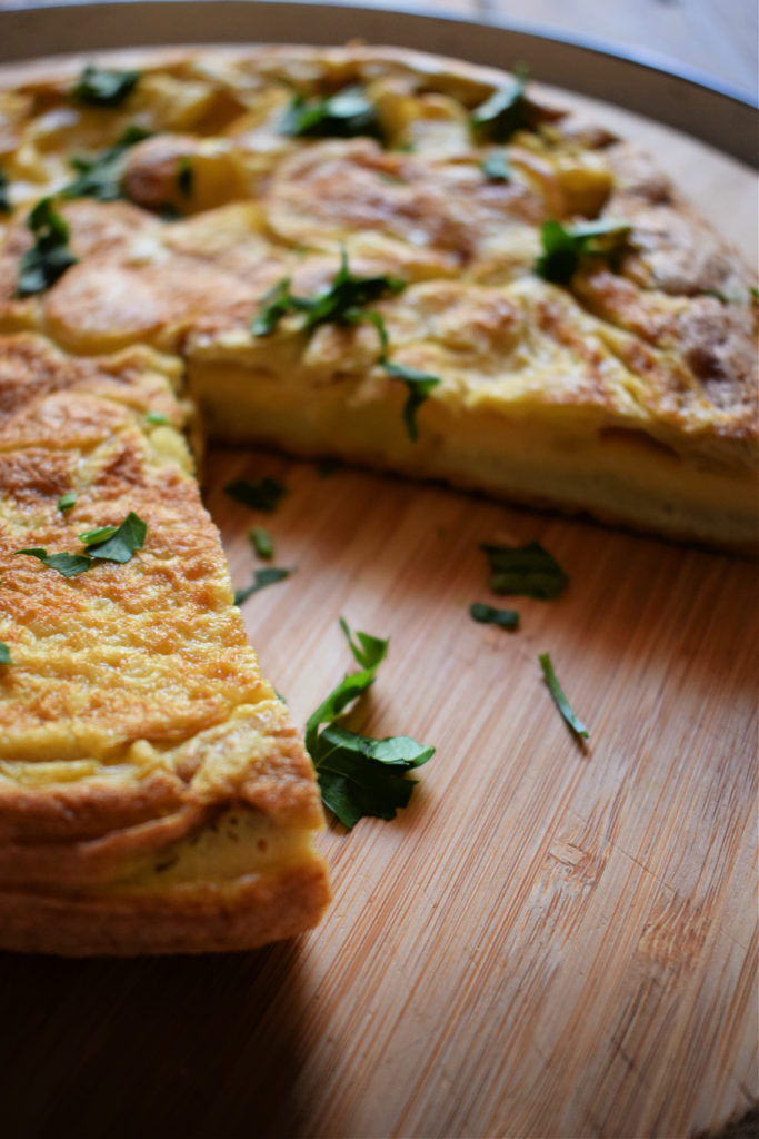 A Spanish Omelette on a cutting board