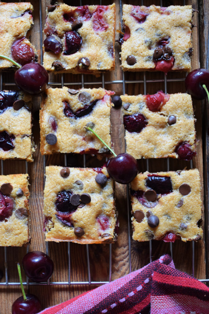 cherry chocolate chip blondies on a cooling rack