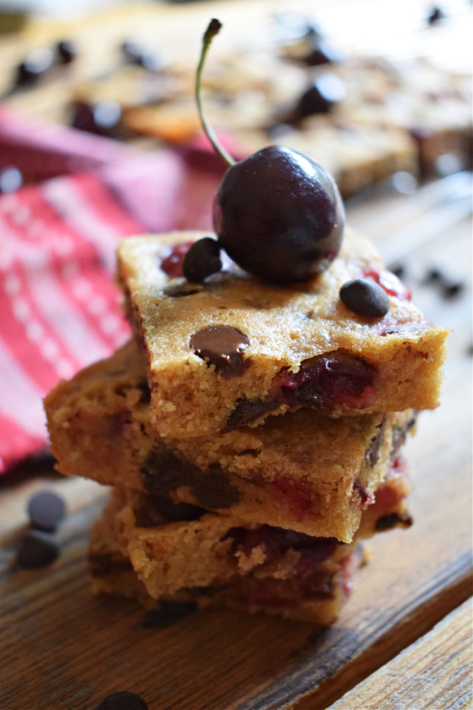 a stack of cherry chocolate chip blondies