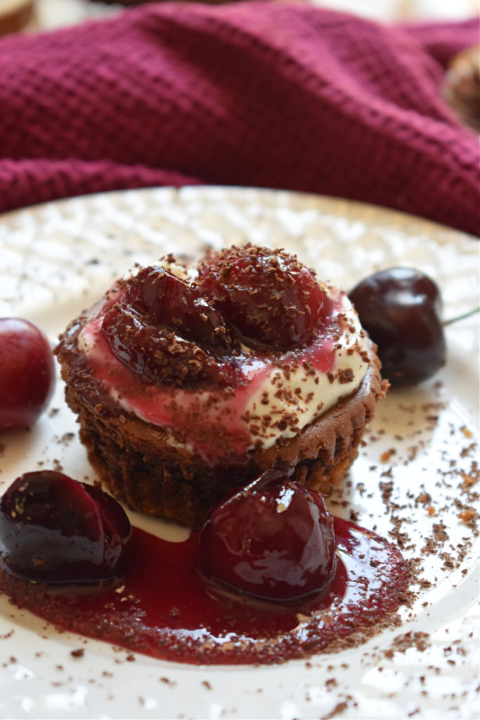 black forest cheesecakes on a white plate