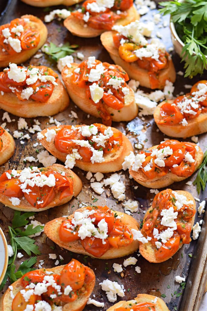 Tomato feta bruschetta on a tray.