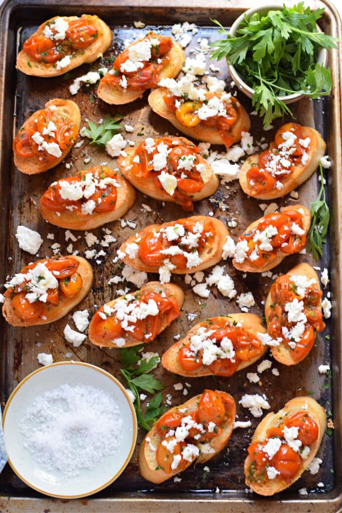 Tomato and feta bruschetta on a tray.