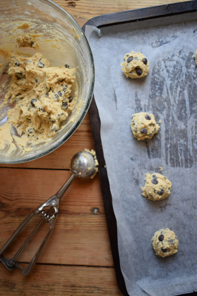 chocolate chip cookie dough on a cookie sheet