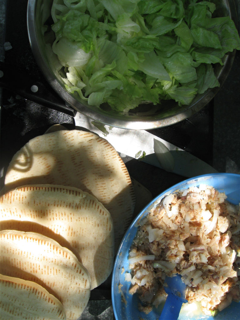 setting up stuff for Pita Tuna Salad Sandwiches camping