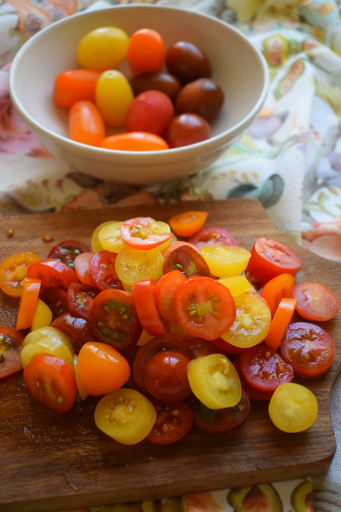 sliced up cherry tomatoes to make the  ricotta and tomato toast
