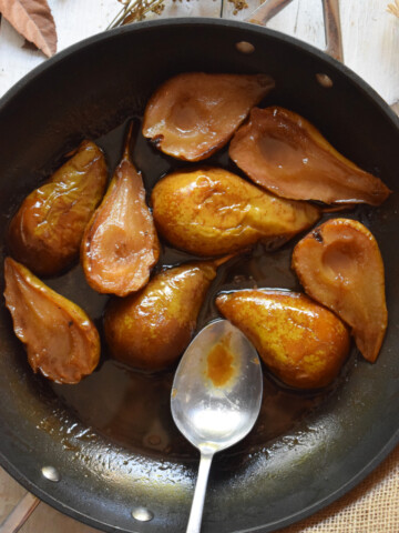 over head view of caramelized pears in a skillet
