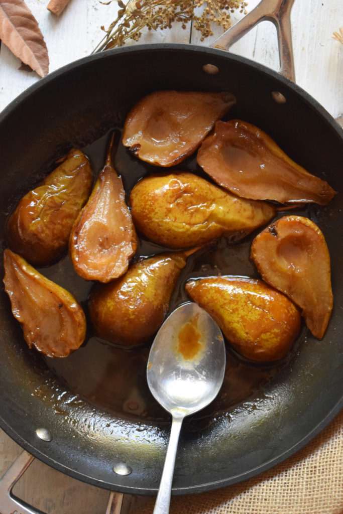 over head view of caramelized pears in a skillet