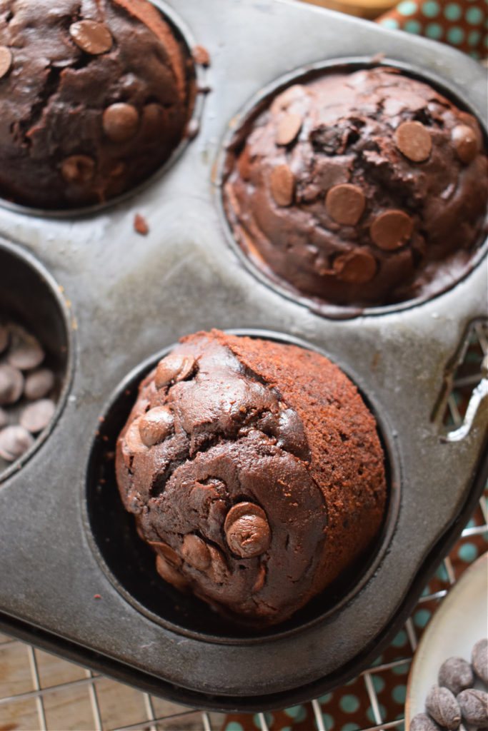 double chocolate zucchini muffins in a baking tin