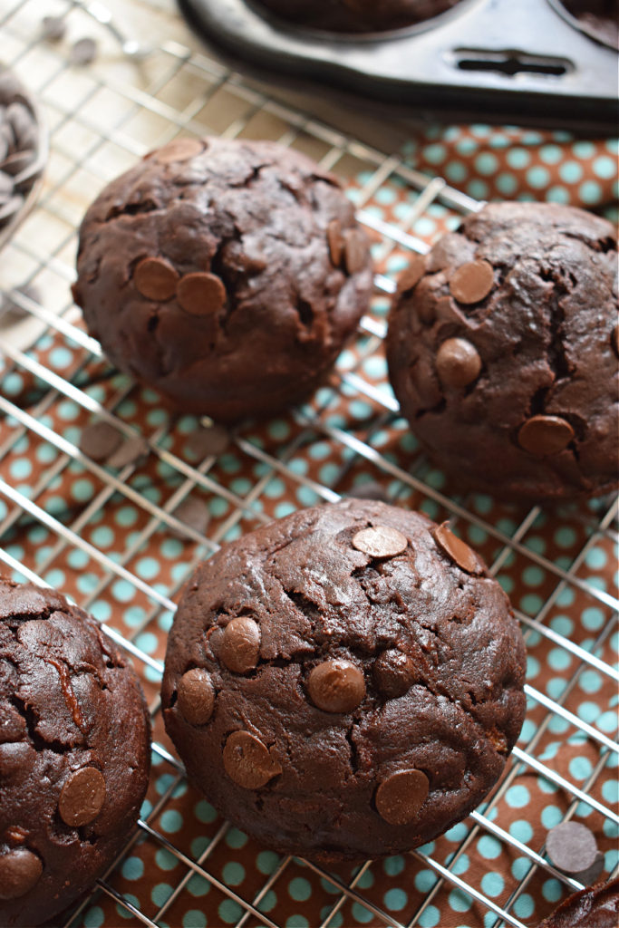 double chocolate zucchini muffins on a cooling rack