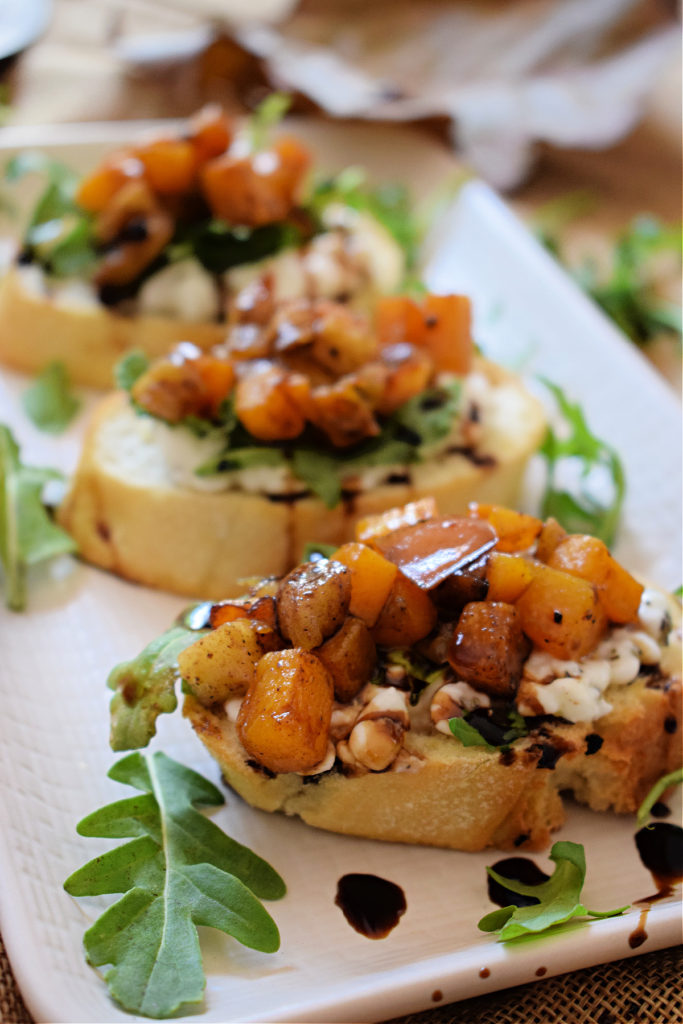 ROASTED BUTTERNUT SQUASH ON A WHITE PLATE