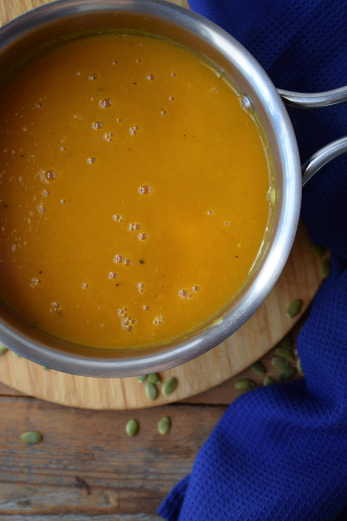 over head view of the butternut squash soup in a pot