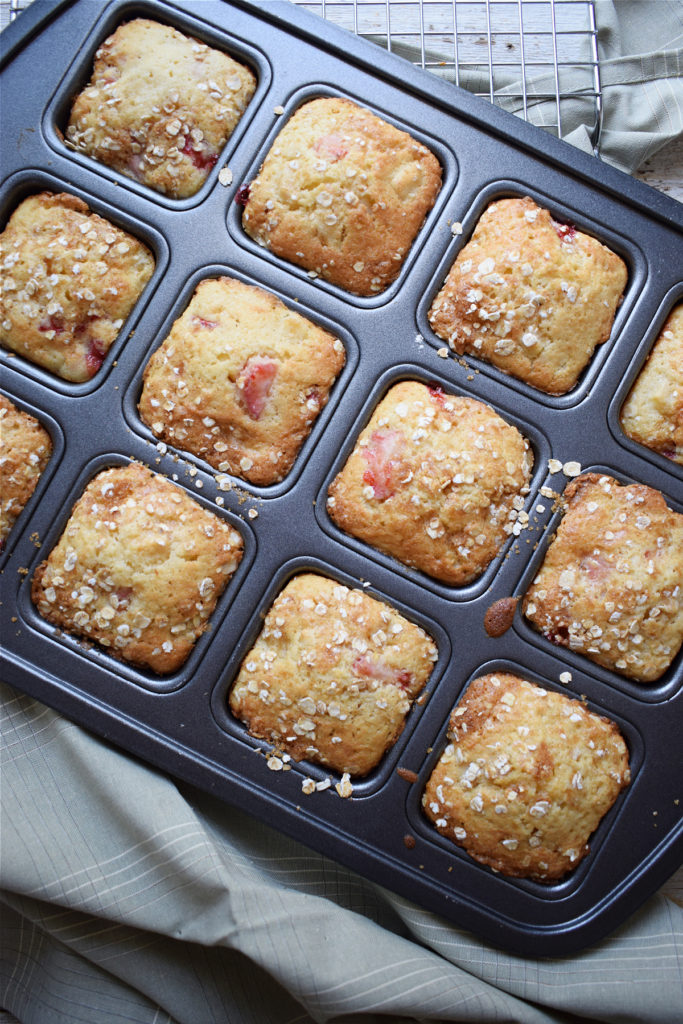 strawberry and apple muffins in a baking tray