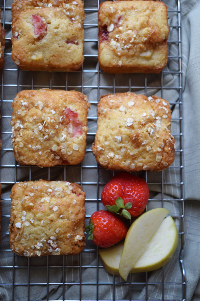 over head view of the strawberry and apple muffin recipe on a cooling rack