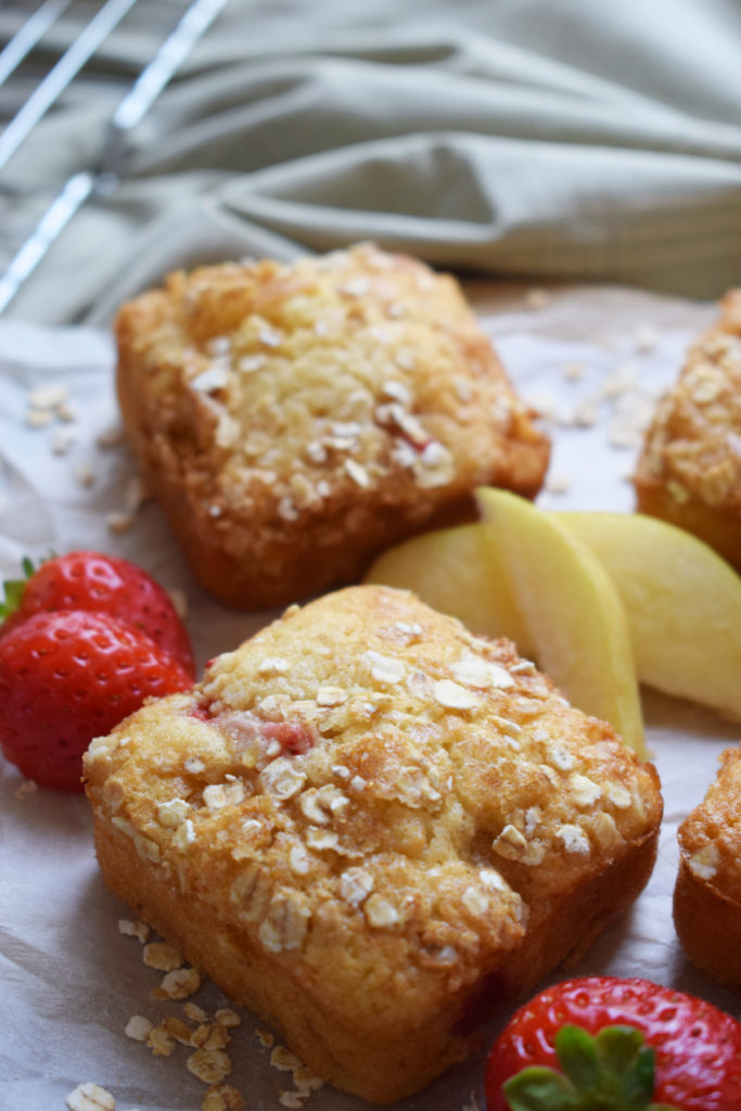 strawberry and apple muffins on a tray