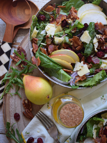 over head view of the pear and pecan salad with cheddar cheese and romaine lettuce