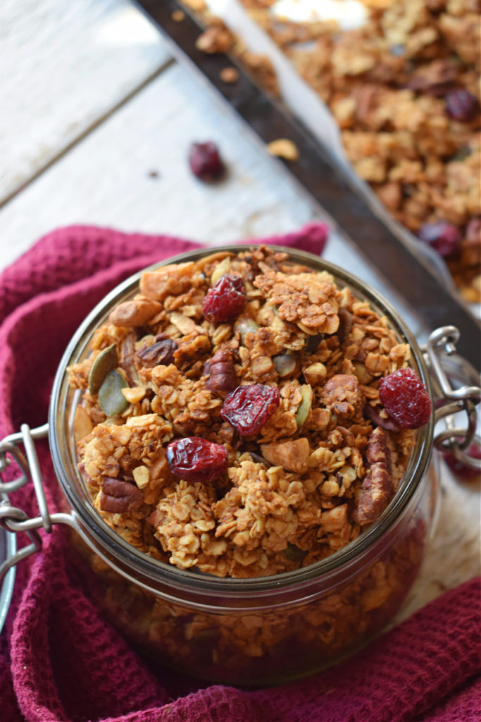 close up of the cranberry pecan granola in a mason jar