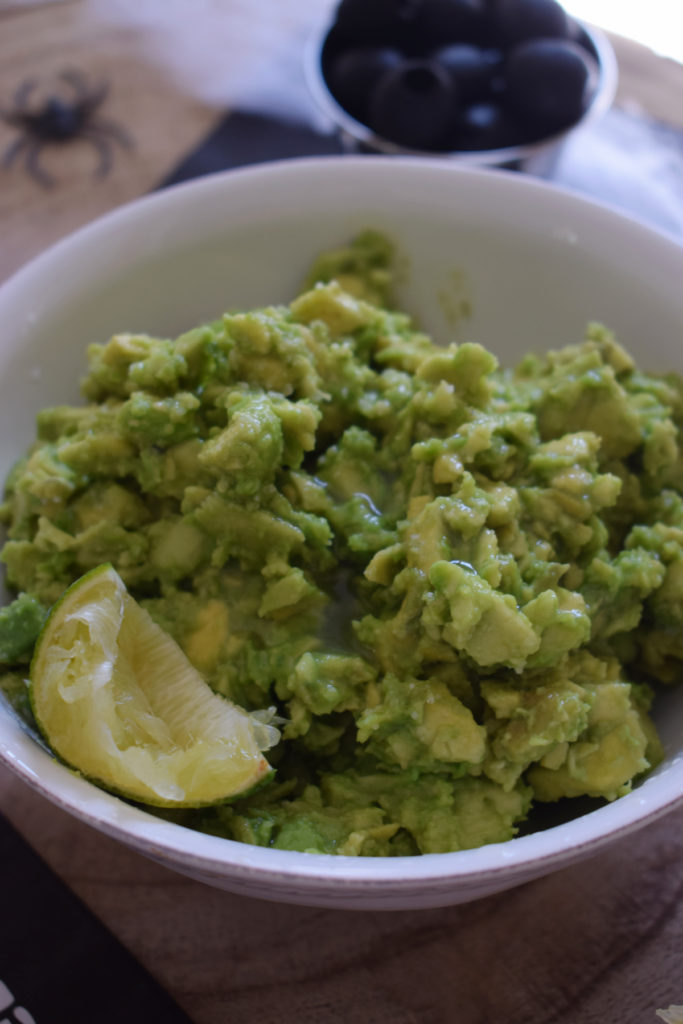 avocado in a bowl with lime