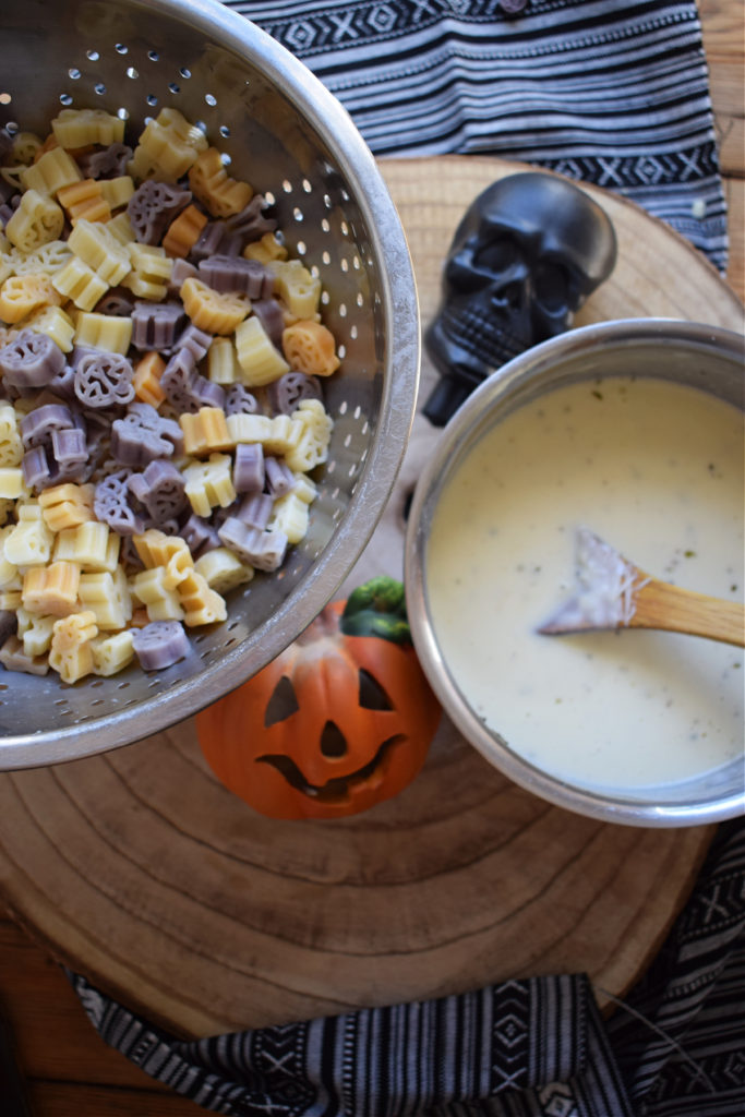cheese sauce and halloween pasta shapes