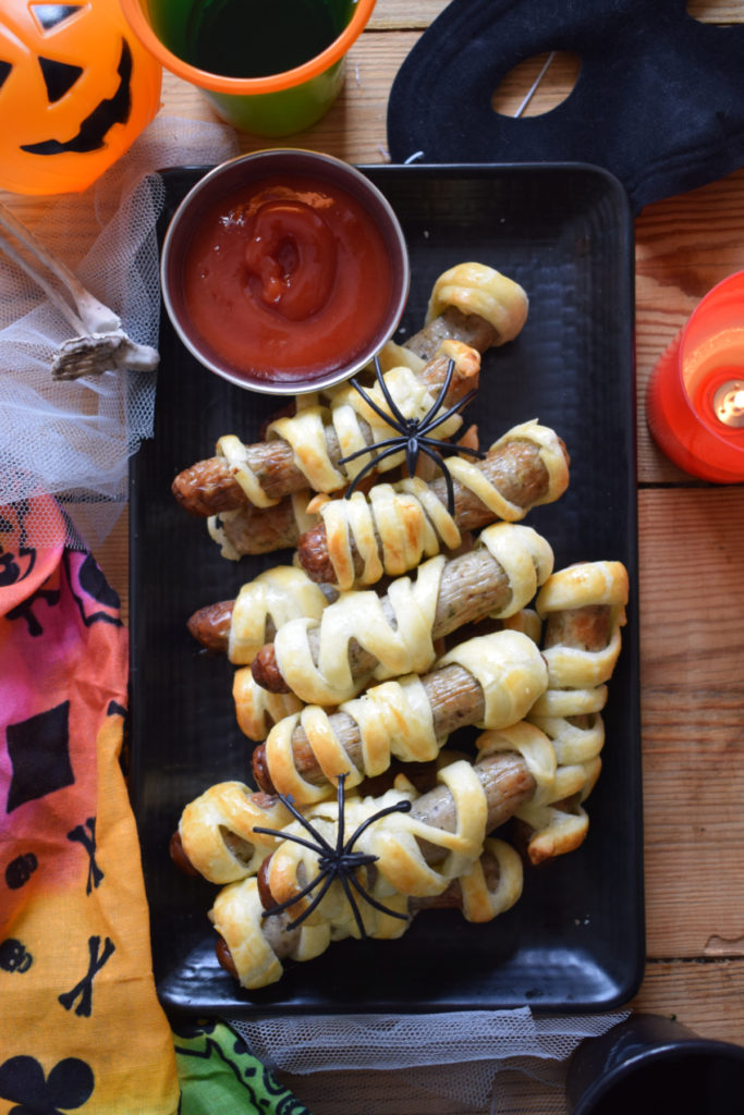 table decorated with mummy sausage rolls