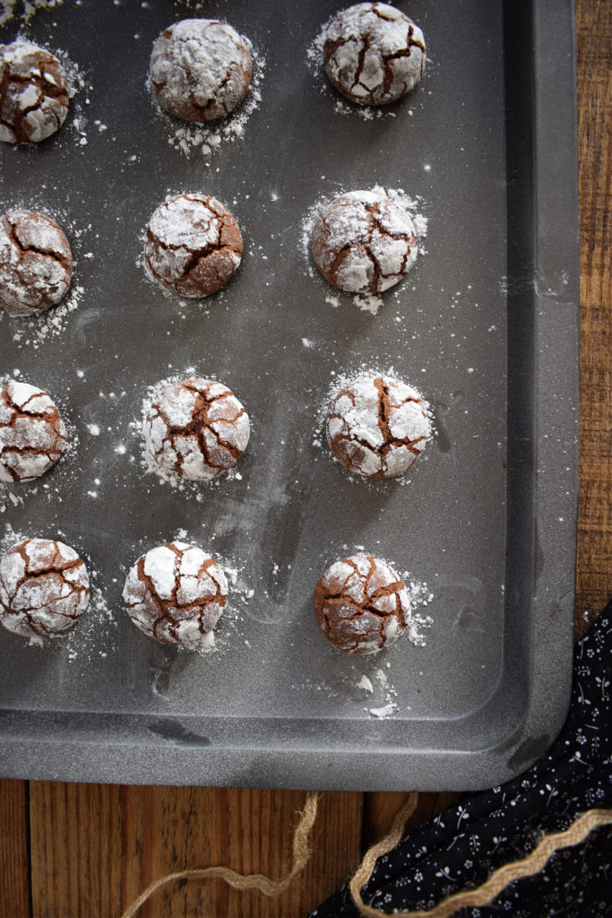 chocolate crinkle cookies on a baking tray
