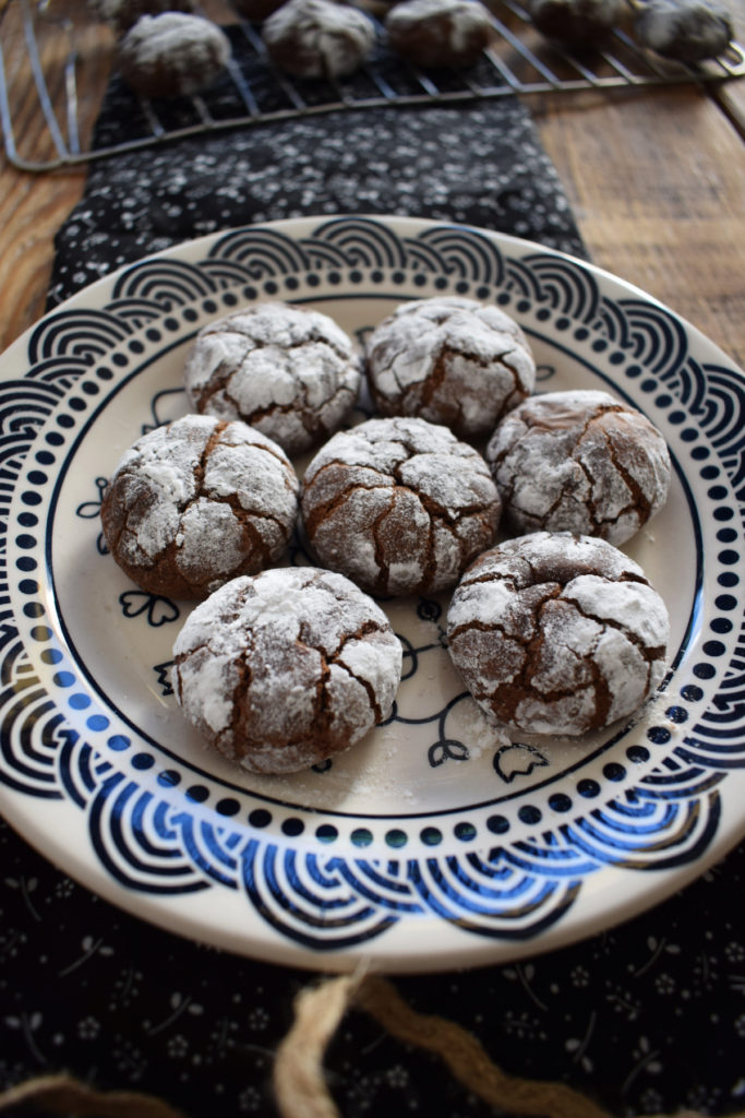chocolate crinkle cookies on a patterned plate