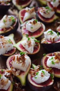 close up photo of the figs with goat cheese and pecans