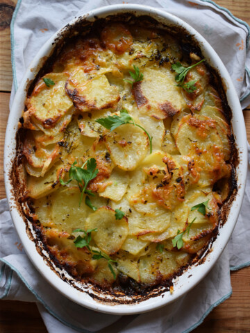 potato and spinach gratin in a casserole dish