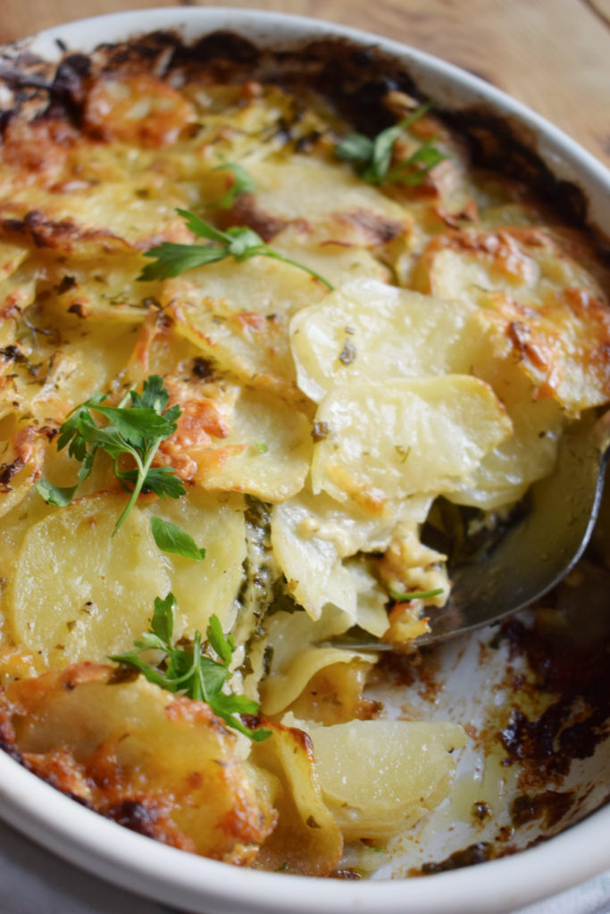 close up of the potato and spinach gratin in a casserole dish