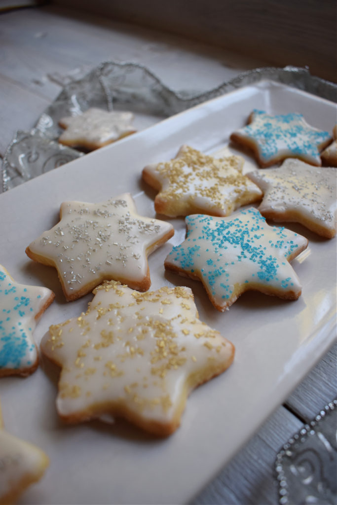christmas sugar cookies on a white plate