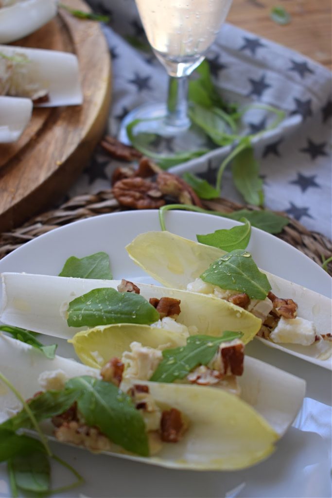 close up of the pecan and goat cheese endive cups