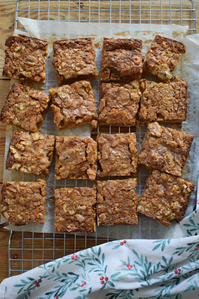 Maple walnut cookies cut into squares on a baking tray