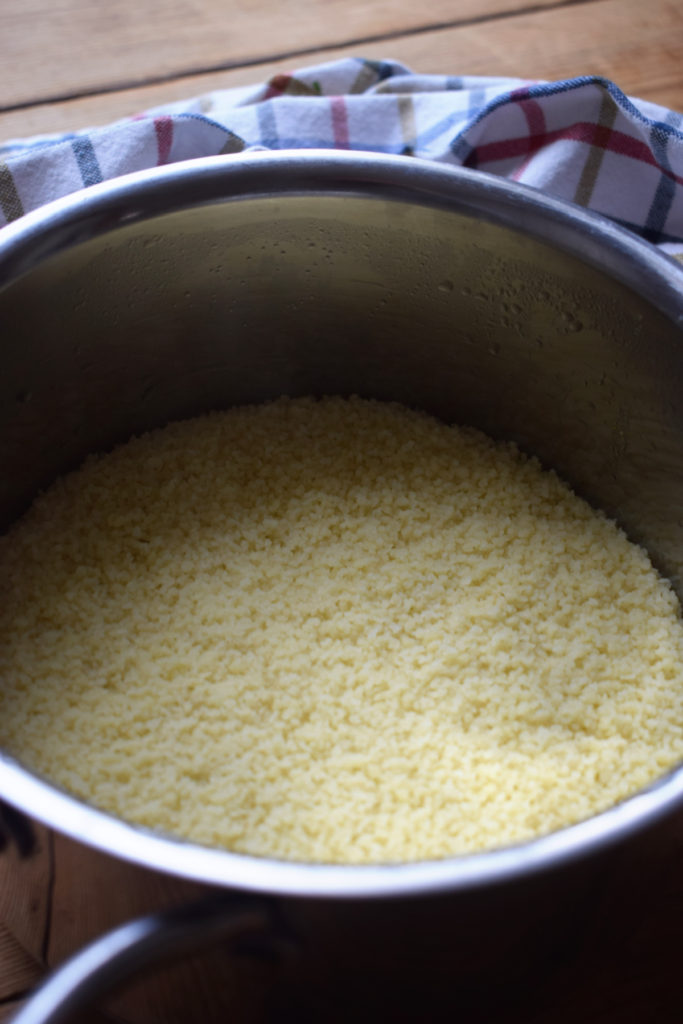 Cooked couscous in a saucepan.
