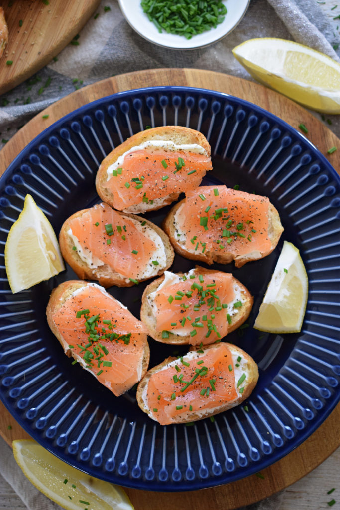 smoked salmon and cream cheese canapes on a blue plate