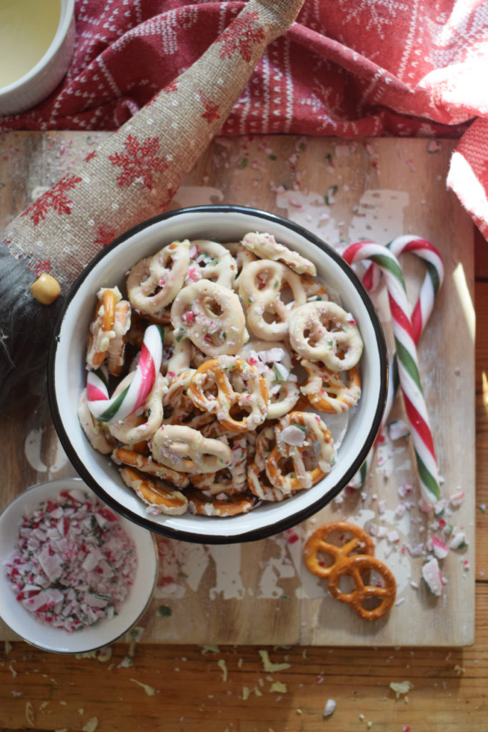 white chocolate pretzels in a bowl with candy canes