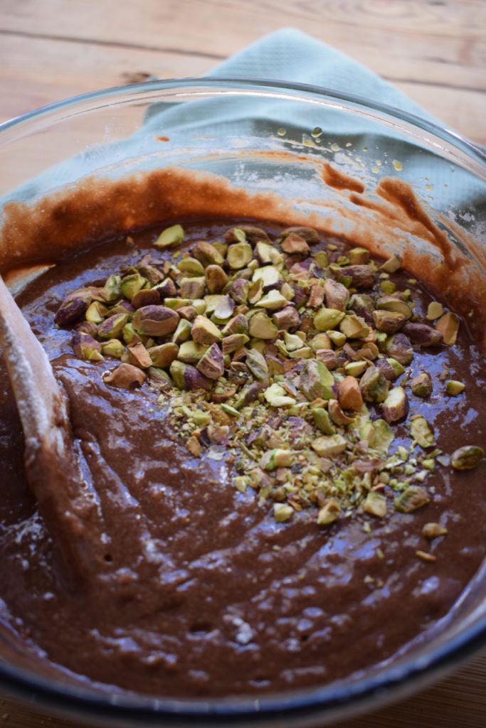 adding pistachios to brownie batter