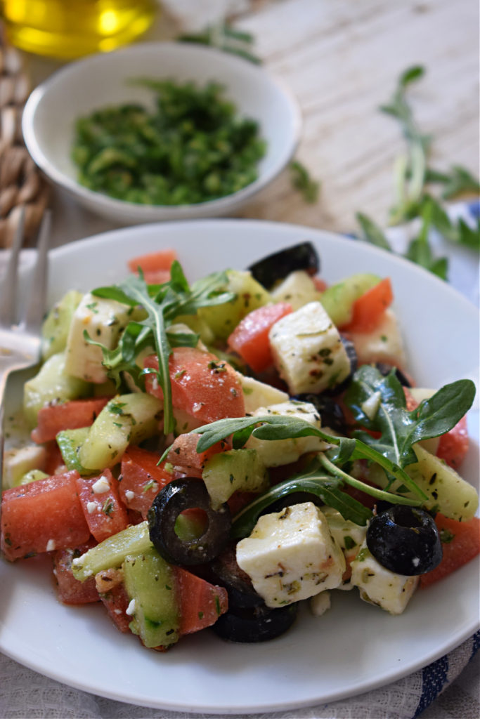close up of a Greek Salad on a white plate