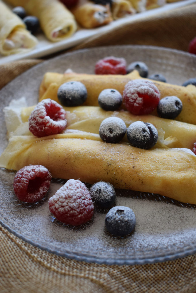 mini berry crepes on a plate