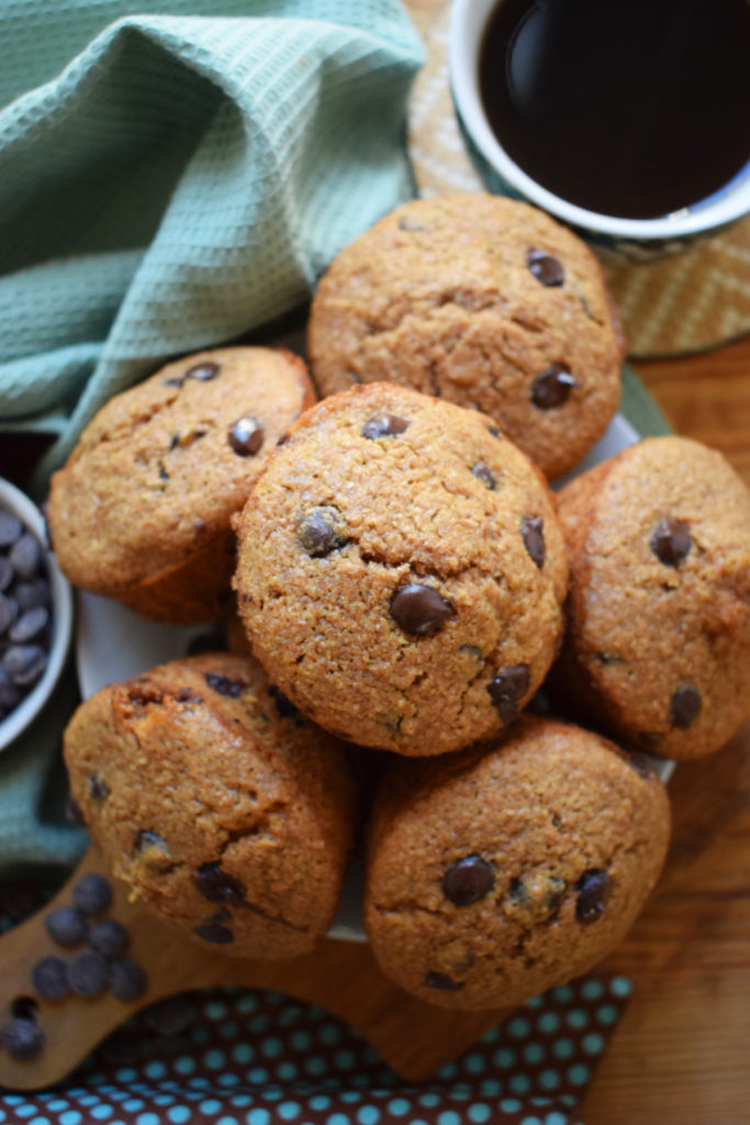 Chocolate chip bran muffins with a cup of coffee.