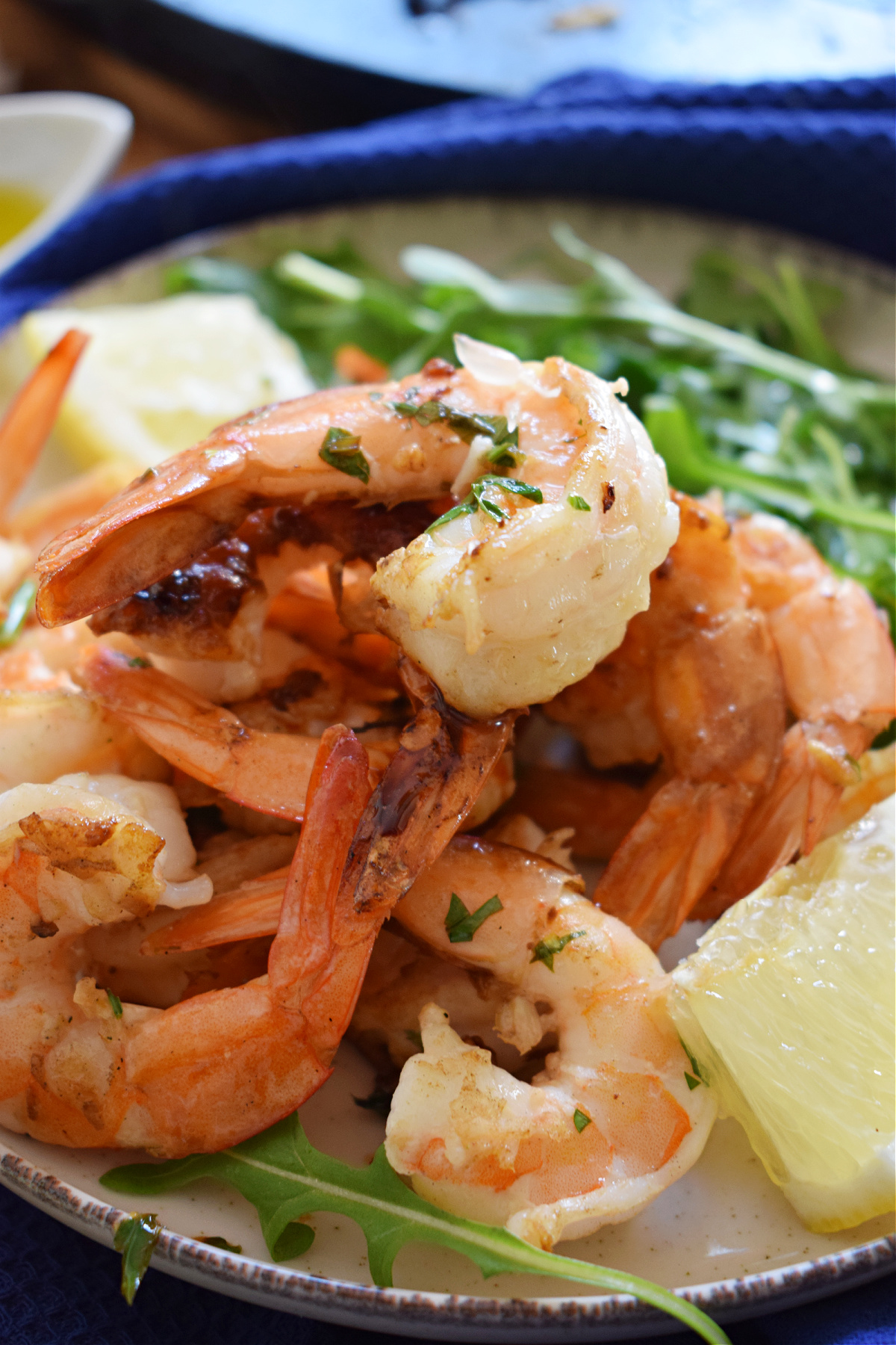 close up of lemon shrimp with a salad