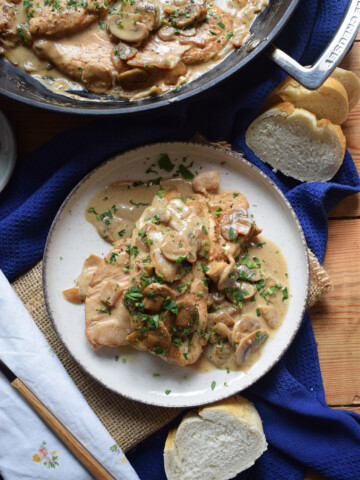 Creamy turkey in a skillet and on a plate.