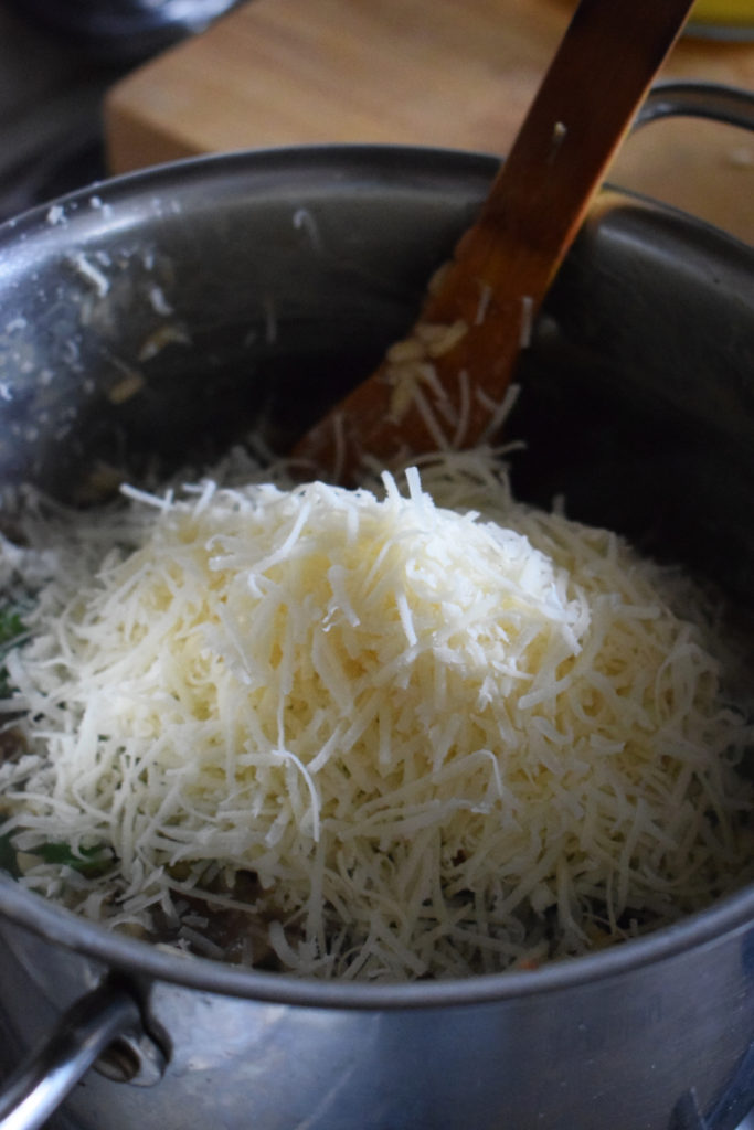 Add parmesan cheese to the risotto.