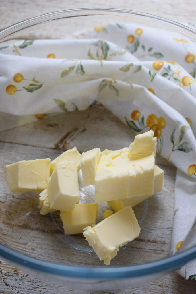 cubed butter in a mixing bowl