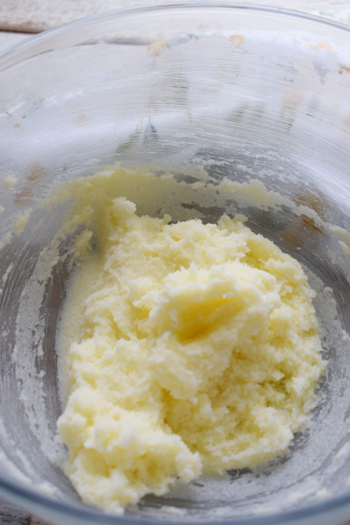 mixing butter and sugar in a bowl.