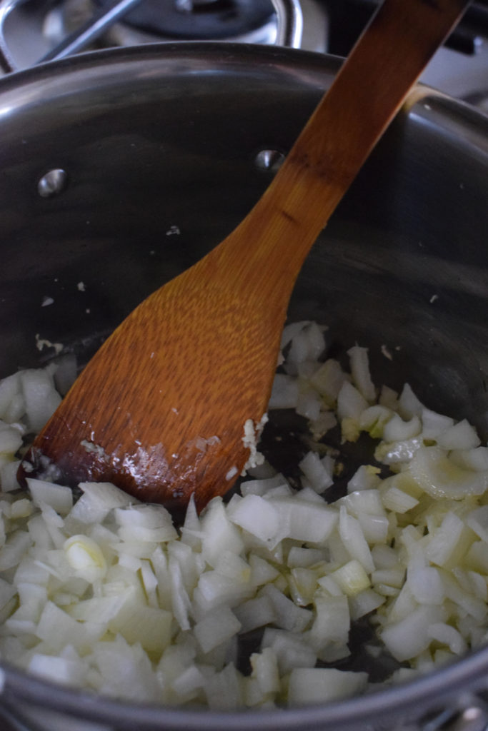Cooking onions in oil and garlic.