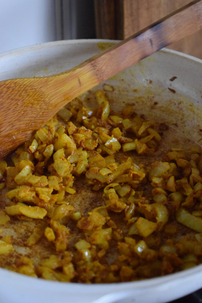 cooking onions in spices.